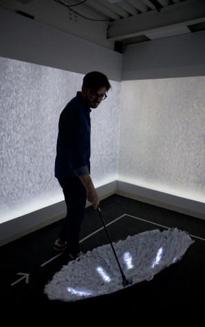 User in the installation room with umbrella